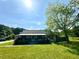 Charming home featuring a cozy porch, lush green lawn, and inviting curb appeal under a sunny sky at 3517 Plunkett Road Rd, Stonecrest, GA 30038