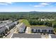 Aerial view of a new townhome community surrounded by lush greenery at 823 Mackay Crk, Woodstock, GA 30188