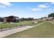 Outdoor amphitheater featuring a green lawn, a stage, and accessible pathways at 823 Mackay Crk, Woodstock, GA 30188