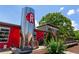 Exterior of Reformation Brewery featuring a large brewing tank and outdoor seating area at 823 Mackay Crk, Woodstock, GA 30188