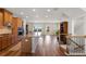 Open-concept kitchen with large island, stainless steel appliances, and seamless flow to living area at 823 Mackay Crk, Woodstock, GA 30188