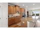Bright kitchen with stainless steel appliances, granite countertops, and wood cabinetry at 823 Mackay Crk, Woodstock, GA 30188