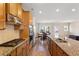 Gourmet kitchen featuring granite countertops, stainless appliances and hardwood floors at 823 Mackay Crk, Woodstock, GA 30188