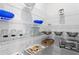 Spacious pantry with wire shelving, providing ample storage space for kitchen essentials and appliances at 823 Mackay Crk, Woodstock, GA 30188