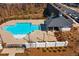Aerial view of a community pool and clubhouse featuring a modern design at 823 Mackay Crk, Woodstock, GA 30188