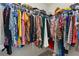 Walk-in closet with clothing racks filled with clothing, providing storage and organization for clothes and accessories at 823 Mackay Crk, Woodstock, GA 30188
