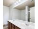 Bathroom with double sink vanity, a large mirror, and combined tub and shower at 1071 N Village Dr, Decatur, GA 30032