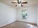Bedroom featuring neutral walls, carpet, a ceiling fan, and a large window at 1071 N Village Dr, Decatur, GA 30032