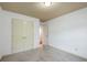 Bright bedroom featuring neutral carpet, fresh paint, an interior door, and closet at 1071 N Village Dr, Decatur, GA 30032