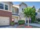 Charming townhouse with a well-manicured front yard and attached garage at 1071 N Village Dr, Decatur, GA 30032