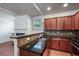 Well-appointed kitchen featuring granite countertops, stainless steel appliances, and convenient access to living space at 1071 N Village Dr, Decatur, GA 30032