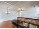 Modern kitchen showcasing granite counters, stainless steel sink, and an open connection to the living room at 1071 N Village Dr, Decatur, GA 30032
