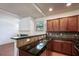 Stylish kitchen featuring granite countertops, stainless steel appliances, and seamless access to the living area at 1071 N Village Dr, Decatur, GA 30032