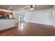 Open-concept living room with hardwood floors, coffered ceilings, and stainless steel kitchen appliances at 1071 N Village Dr, Decatur, GA 30032