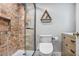 Beautiful bathroom with modern fixtures, including a glass shower and wooden vanity at 199 14Th Ne St # 402, Atlanta, GA 30309