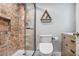 Modern bathroom with a walk-in shower with brick-style tile and a sleek toilet with bidet at 199 14Th Ne St # 402, Atlanta, GA 30309