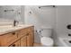 Bathroom with modern vanity, granite countertops, large mirror, and a toilet at 199 14Th Ne St # 402, Atlanta, GA 30309