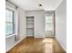 Bright bedroom with hardwood floors, built-in shelving, and natural light at 199 14Th Ne St # 402, Atlanta, GA 30309