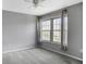 Bright bedroom featuring a ceiling fan, gray walls, large windows, and neutral carpet at 199 14Th Ne St # 402, Atlanta, GA 30309