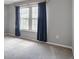 Bedroom featuring gray carpet, neutral walls, and plenty of natural light at 199 14Th Ne St # 402, Atlanta, GA 30309