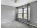Neutral bedroom has carpet, ceiling fan, and a bright window with attractive curtains at 199 14Th Ne St # 402, Atlanta, GA 30309