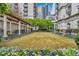 A tranquil courtyard perfect for relaxation, surrounded by lush greenery and seating at 199 14Th Ne St # 402, Atlanta, GA 30309
