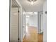 Hallway with hardwood floors leading to a naturally lit living space at 199 14Th Ne St # 402, Atlanta, GA 30309