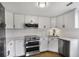 Modern kitchen with stainless steel appliances and white cabinets at 199 14Th Ne St # 402, Atlanta, GA 30309