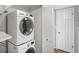 Convenient laundry area with a stacked washer and dryer and a storage closet at 199 14Th Ne St # 402, Atlanta, GA 30309