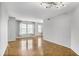 Bright living room with many windows and gleaming hardwood floors at 199 14Th Ne St # 402, Atlanta, GA 30309