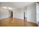 Living room with hardwood floors leading to kitchen and hallway at 199 14Th Ne St # 402, Atlanta, GA 30309