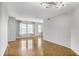 Inviting living room with plenty of natural light from multiple windows and hardwood flooring at 199 14Th Ne St # 402, Atlanta, GA 30309