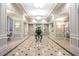 Elegant lobby with marble floors, decorative lighting, and a stunning floral arrangement at 199 14Th Ne St # 402, Atlanta, GA 30309