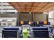 Inviting outdoor lounge with comfortable seating and a built-in grilling station under a wooden pergola at 199 14Th Ne St # 402, Atlanta, GA 30309
