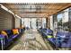 Relaxing outdoor lounge area with ample seating, a pergola, and views of the surrounding cityscape at 199 14Th Ne St # 402, Atlanta, GA 30309