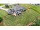 Expansive backyard featuring a covered patio and black metal fence surrounding the property at 265 Enfield Ln, Mcdonough, GA 30252