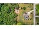 The home is surrounded by mature trees and lush landscaping, including a putting green at 265 Enfield Ln, Mcdonough, GA 30252
