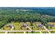 A beautiful aerial view of houses with an abundance of lush tree coverage at 265 Enfield Ln, Mcdonough, GA 30252