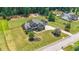 Beautiful aerial of traditional home and spacious lawns showcasing impeccable landscaping and curb appeal at 265 Enfield Ln, Mcdonough, GA 30252