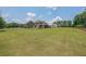Expansive backyard with lush green lawn and partially fenced area, perfect for outdoor activities at 265 Enfield Ln, Mcdonough, GA 30252