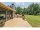 Stone patio with outdoor grill and a spacious backyard with playground at 265 Enfield Ln, Mcdonough, GA 30252