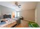 Spacious bedroom with neutral walls, ceiling fan, carpet flooring and natural light at 265 Enfield Ln, Mcdonough, GA 30252