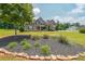Well-maintained front yard with lush lawn, landscaping, and stone edging at 265 Enfield Ln, Mcdonough, GA 30252
