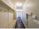 Hallway with coat hooks, storage bench, and neutral decor at 265 Enfield Ln, Mcdonough, GA 30252