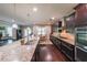 Kitchen featuring a large island with a sink and ample counter space, perfect for cooking and entertaining at 265 Enfield Ln, Mcdonough, GA 30252