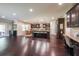 Open concept kitchen and dining area with dark wood cabinets and stainless steel appliances at 265 Enfield Ln, Mcdonough, GA 30252