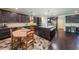 Modern kitchen with dark wood cabinets, granite countertops, and stainless steel appliances at 265 Enfield Ln, Mcdonough, GA 30252