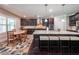 Kitchen with granite countertops, a large island with seating, and a breakfast nook at 265 Enfield Ln, Mcdonough, GA 30252