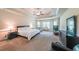 Spacious main bedroom with trey ceilings and seating area at 265 Enfield Ln, Mcdonough, GA 30252