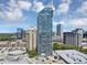 An aerial view captures the high-rise building, adjacent parking, and surrounding cityscape at 3338 Peachtree Ne Rd # 508, Atlanta, GA 30326
